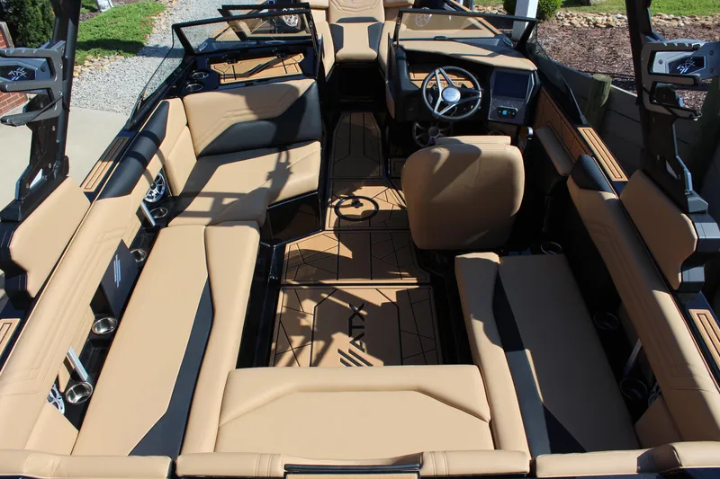 Slide: The Image of 2025 ATX Surf Boats 22 Type-S interior with tan seating and modern dashboard design. - 9