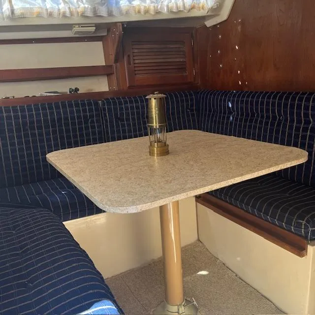 Slide: The Image of Interior of a 1985 Catalina 30 sailboat with a cozy dining area. - 3