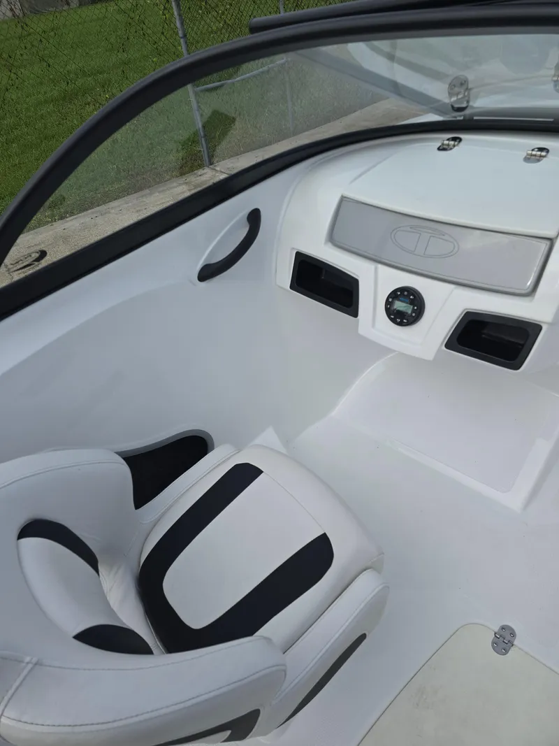 Slide: The Image of 2021 Tahoe 450 TF boat interior with sleek white and black seating. - 12