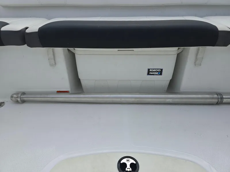 Slide: The Image of 2021 Tahoe 450 TF boat interior with Igloo cooler and metal rod. - 15