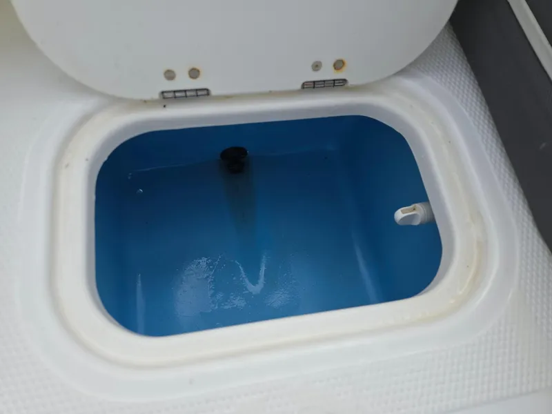 Slide: The Image of Open storage compartment in 2021 Tahoe 450 TF boat. - 17