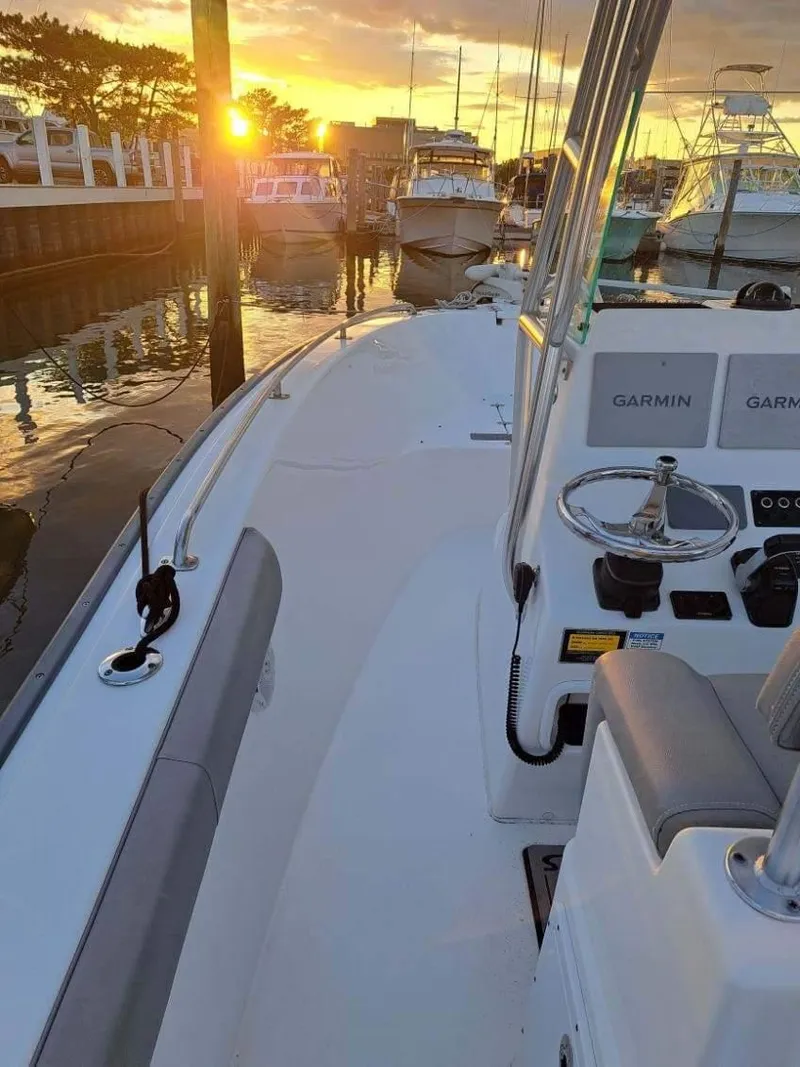 Slide: The Image of 2020 Cape Horn 22 OS boat docked at sunset, featuring Garmin equipment. - 11
