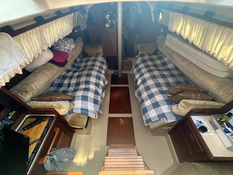 Slide: The Image of Interior of 1983 O'Day 28 sailboat with twin beds and cozy cabin layout. - 11