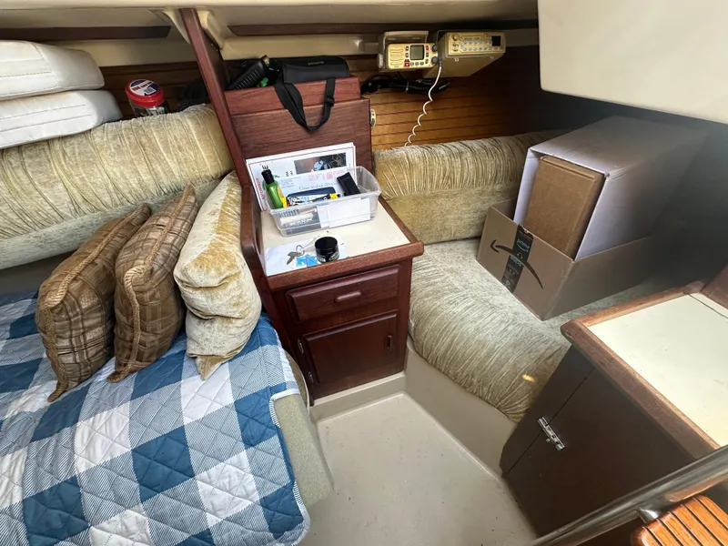 Slide: The Image of Interior of 1983 O'Day 28 sailboat with cozy seating and storage. - 19
