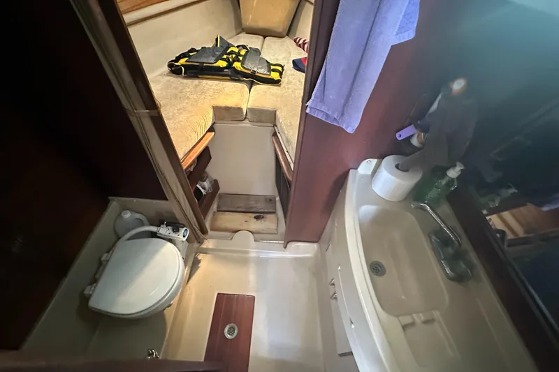 Slide: The Image of 1983 O'Day 28 sailboat interior with bathroom and cabin view. - 23