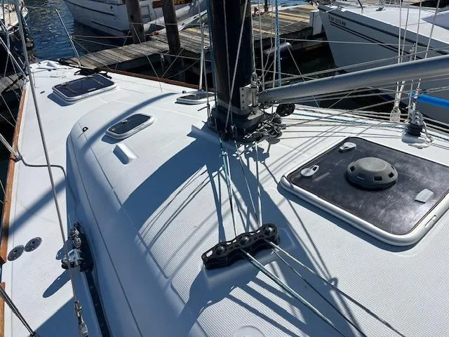 Slide: The Image of Sailboat deck of 2007 Beneteau First 36.7, showing rigging and hatches at marina. - 13