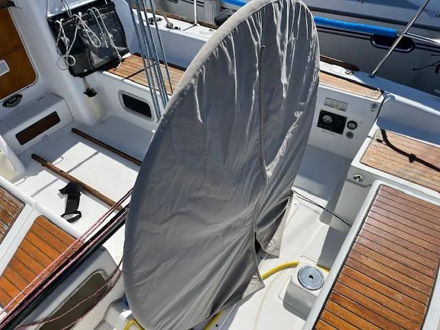 Slide: The Image of Beneteau First 36.7 sailboat cockpit, 2007 model, with covered wheel and teak flooring. - 16