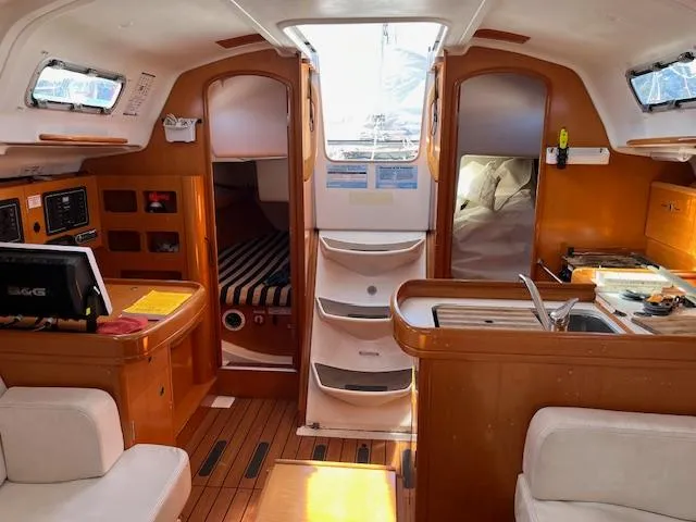 Slide: The Image of Interior of 2007 Beneteau First 36.7 sailboat, featuring cozy cabin and modern amenities. - 27