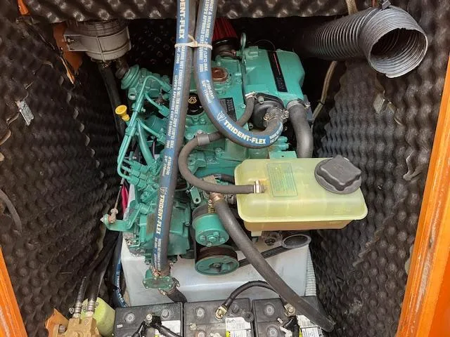 Slide: The Image of Engine compartment of a 2007 Beneteau First 36.7 sailboat, featuring a well-maintained marine engine. - 28