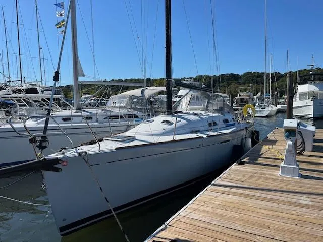 Slide: The Image of 2007 Beneteau First 36.7 sailboat docked at a marina on a sunny day. - 29