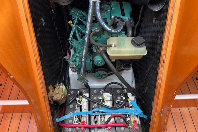 Slide: The Image of Engine compartment of a 2007 Beneteau First 36.7 sailboat, featuring batteries and mechanical components. - 31