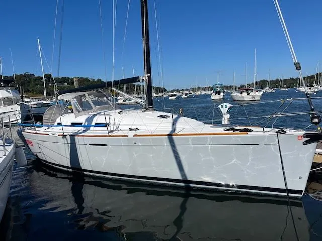 Slide: The Image of 2007 Beneteau First 36.7 sailboat docked in a marina under clear blue skies. - 5