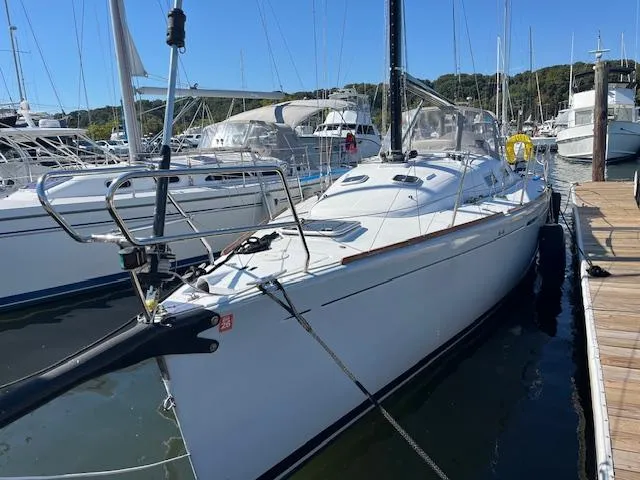 Slide: The Image of 2007 Beneteau First 36.7 sailboat docked at marina, clear sky background. - 8