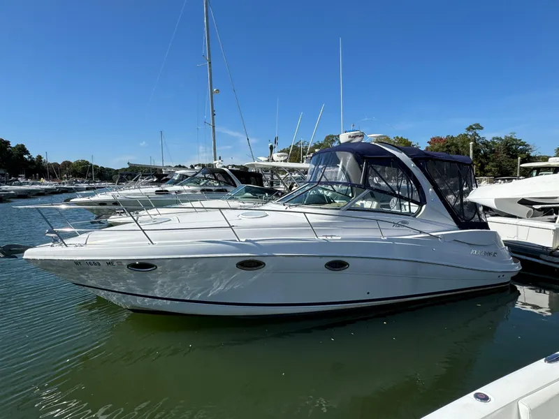 The Image of 2007 Four Winns 318 Vista boat docked in a marina under clear blue skies. - 0