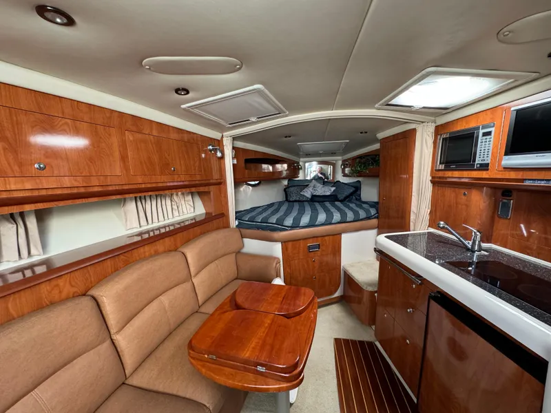 Slide: The Image of Interior of 2007 Four Winns 318 Vista yacht with kitchen, seating, and bed. - 12