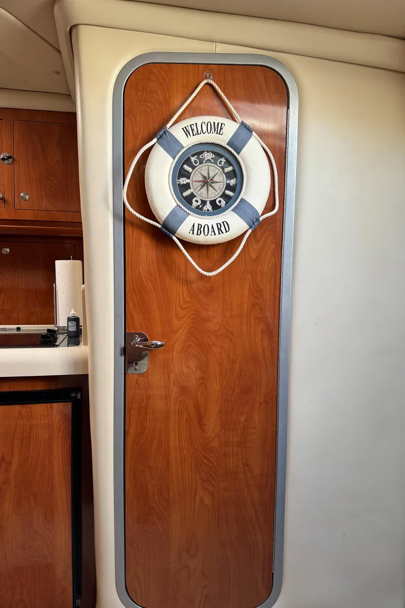 Slide: The Image of 2007 Four Winns 318 Vista cabin door with nautical decor. - 17