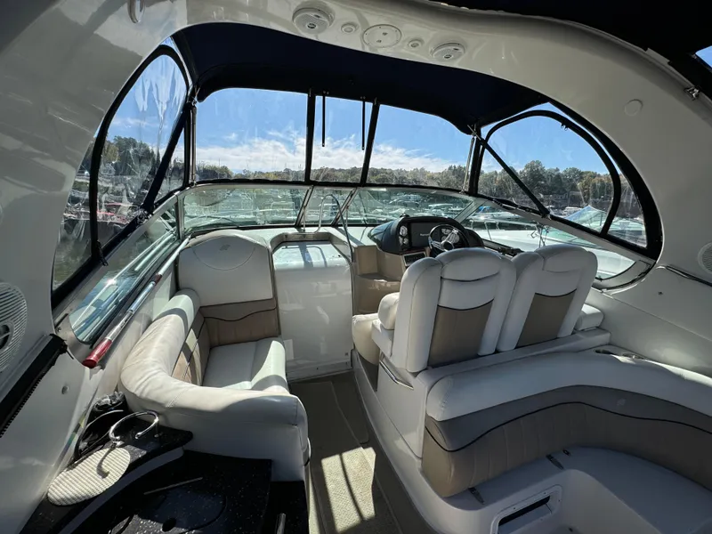 Slide: The Image of Interior of 2007 Four Winns 318 Vista boat with plush seating and modern dashboard. - 8