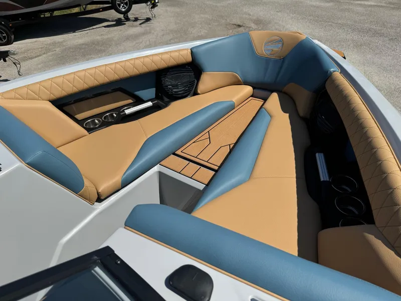 Slide: The Image of 2025 Tigé Z3 boat interior with tan and blue seating, featuring modern design and luxury finishes. - 10