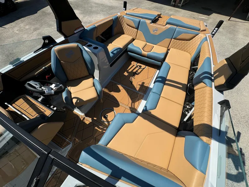Slide: The Image of 2025 Tigé Z3 boat interior with luxurious tan and blue seating, modern design. - 9