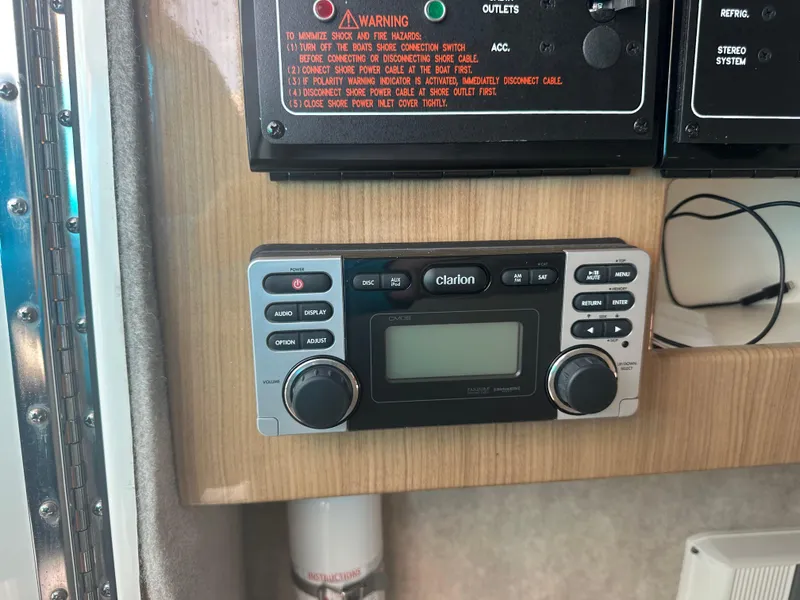 Slide: The Image of Clarion stereo system on 2015 Formula 310 Bowrider boat dashboard. - 21