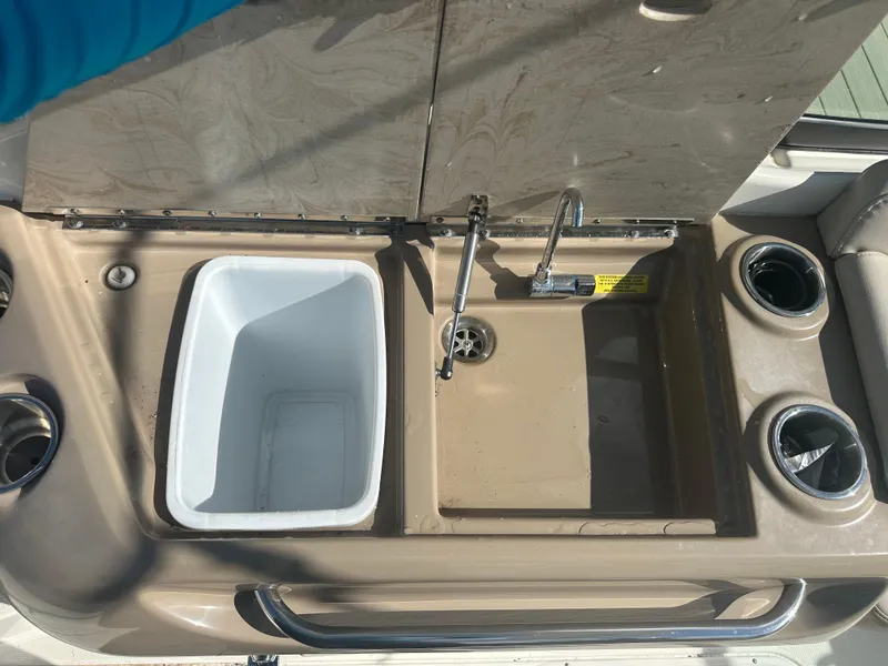 Slide: The Image of 2015 Formula 310 Bowrider sink and cooler setup with cup holders. - 8