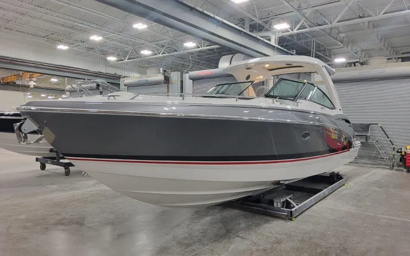 Slide: The Image of 2025 Formula 350 CBR boat in a showroom, featuring sleek design and modern amenities. - 1
