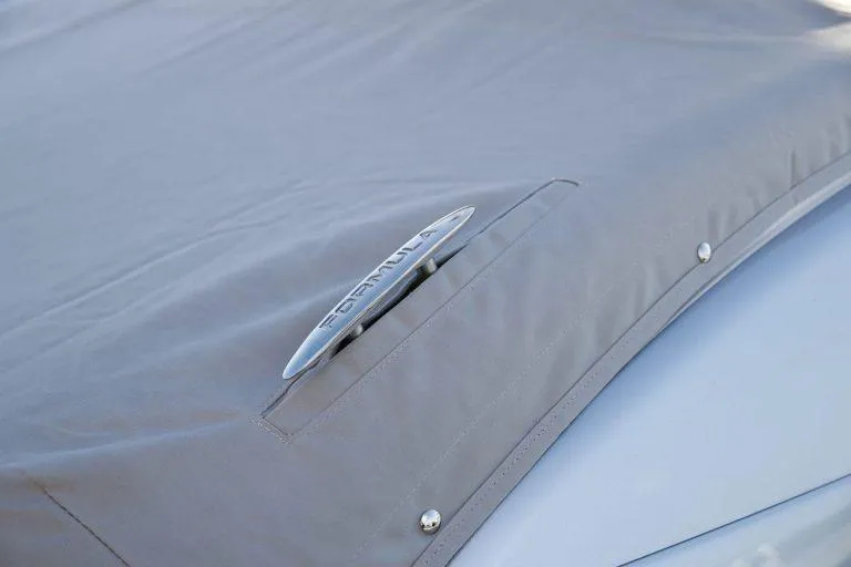 Slide: The Image of 2025 Formula 350 CBR boat with protective cover and visible cleat. - 11