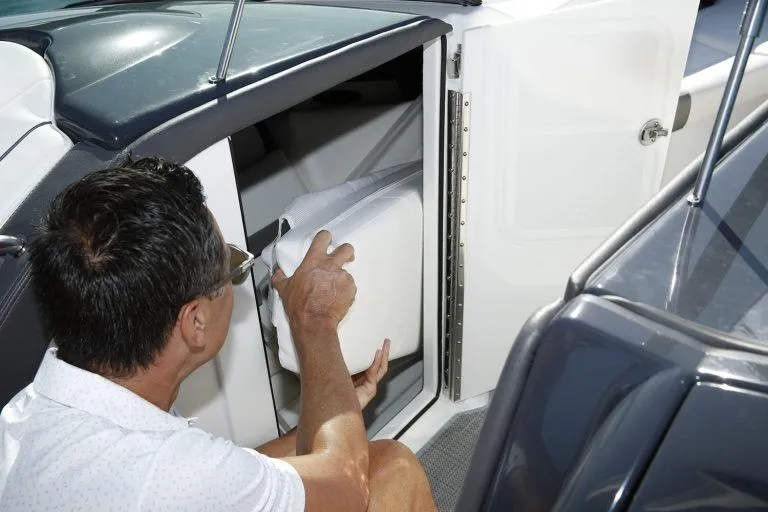 Slide: The Image of Man accessing storage on 2025 Formula 350 CBR boat. - 22