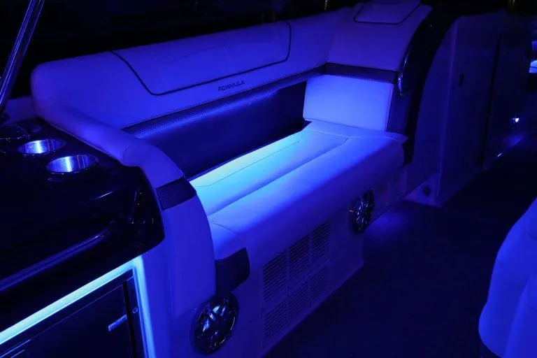 Slide: The Image of 2025 Formula 350 CBR boat interior with blue ambient lighting. - 30