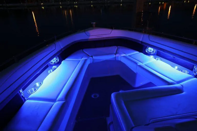 Slide: The Image of 2025 Formula 350 CBR boat interior with blue LED lighting at night. - 31