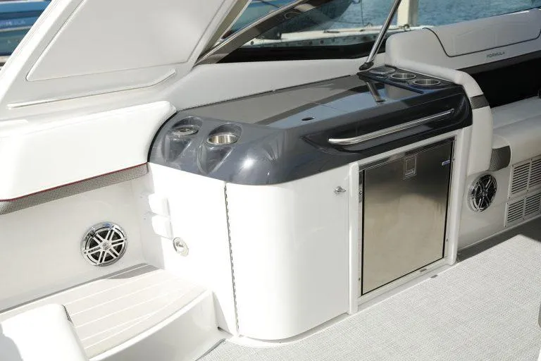Slide: The Image of 2025 Formula 350 CBR boat interior with sleek kitchenette and modern design. - 33
