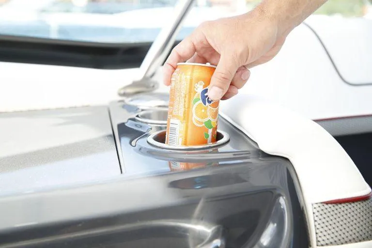 Slide: The Image of Hand placing soda can in cup holder on 2025 Formula 350 CBR boat. - 37