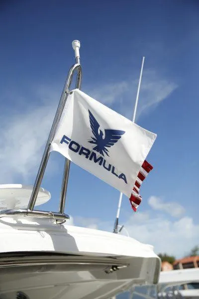 Slide: The Image of Flag on 2025 Formula 350 CBR boat against clear blue sky. - 43