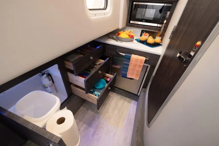 Slide: The Image of Interior of 2025 Formula 350 CBR boat with kitchen amenities and storage drawers. - 45