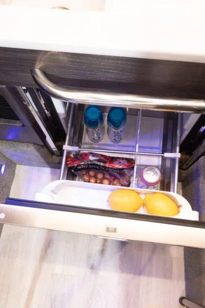 Slide: The Image of 2025 Formula 350 CBR interior fridge with drinks and fruits. - 48