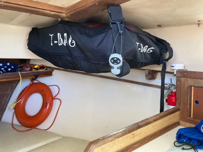 Slide: The Image of Interior of 1983 Fortier 26 boat with life preserver and T-Bag storage. - 29