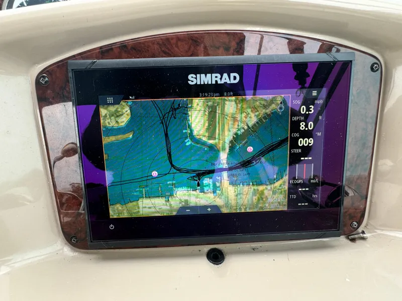 Slide: The Image of Simrad navigation display on 2003 Sea Ray 320 Sundancer boat dashboard. - 25