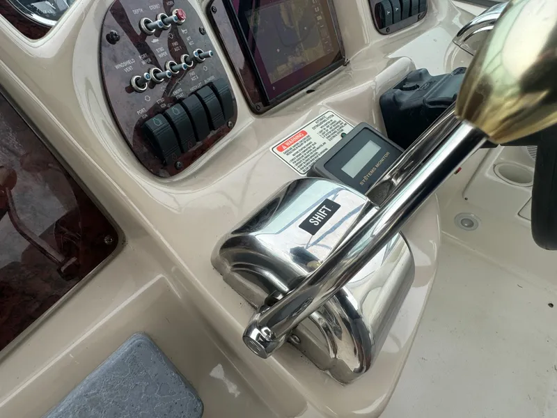 Slide: The Image of Close-up of 2003 Sea Ray 320 Sundancer boat controls and dashboard. - 26