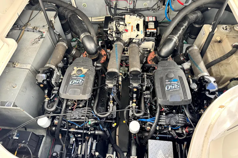 Slide: The Image of Engine compartment of a 2003 Sea Ray 320 Sundancer with twin MerCruiser 350 MAG MPI engines. - 39
