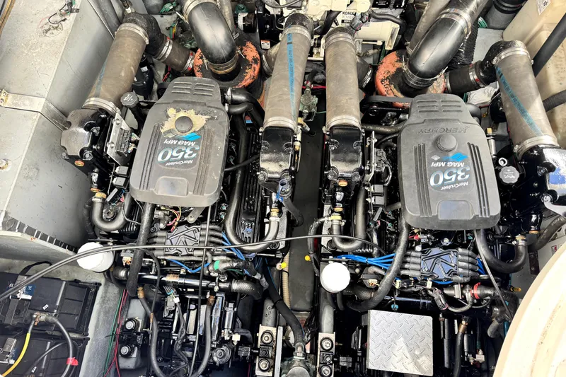 Slide: The Image of Engine compartment of a 2003 Sea Ray 320 Sundancer with twin MerCruiser 350 MAG MPI engines. - 40