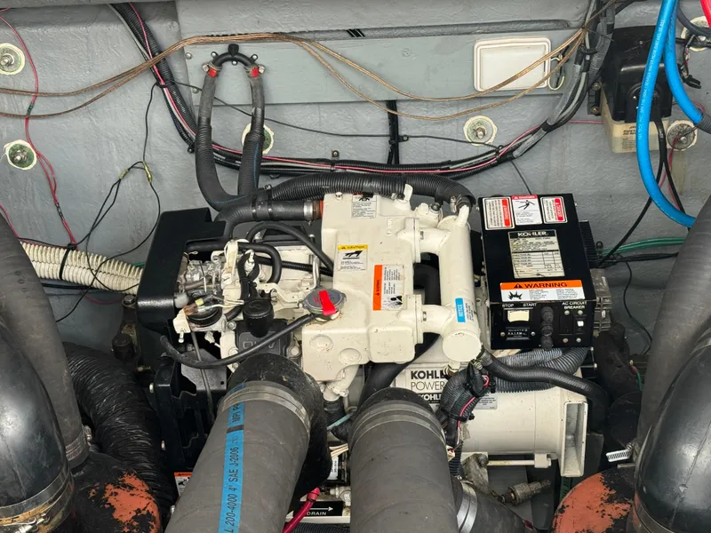 Slide: The Image of Engine compartment of 2003 Sea Ray 320 Sundancer with Kohler generator. - 41