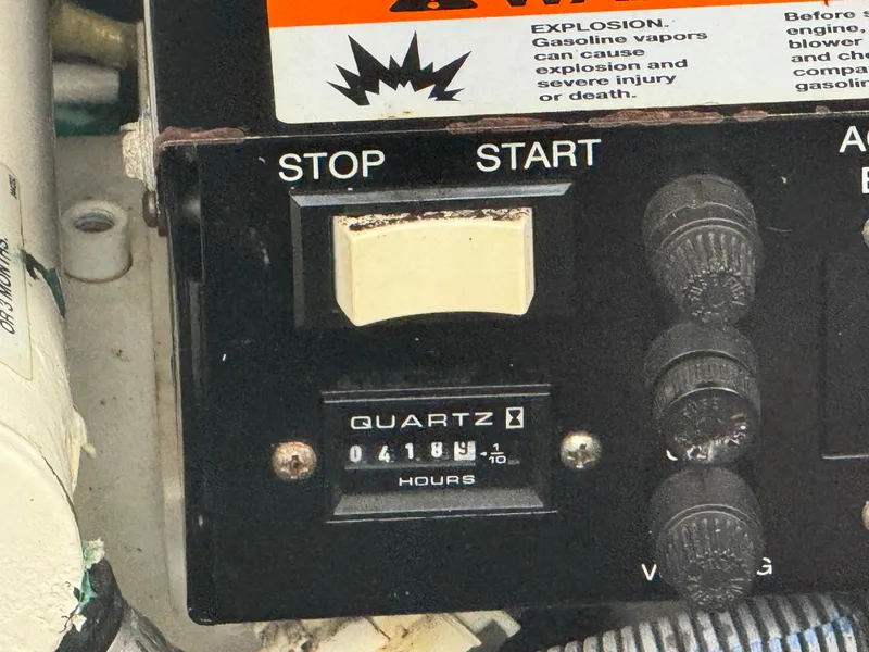 Slide: The Image of Control panel of a 2003 Sea Ray 320 Sundancer with hour meter reading 4184. - 42