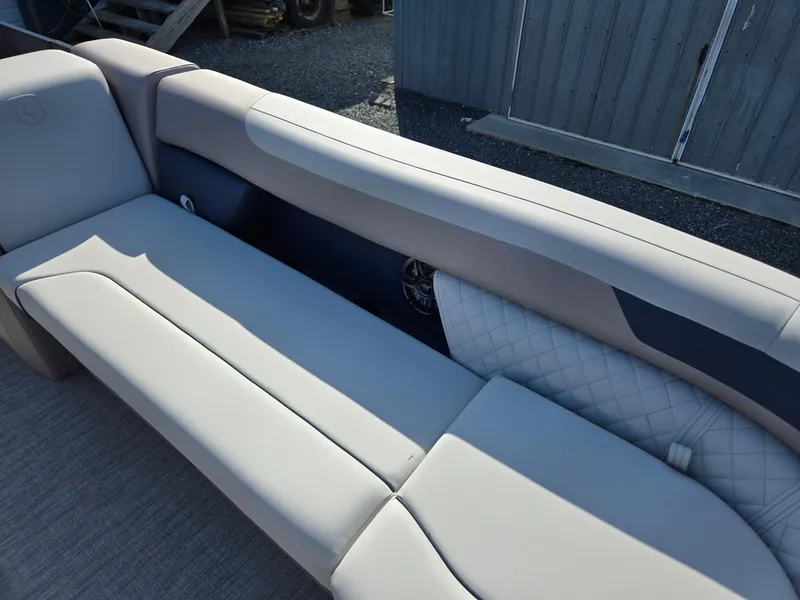 Slide: The Image of 2025 Godfrey SWEETWATER Entertainment 2486 DT boat seating, featuring sleek, modern design and comfortable upholstery. - 11