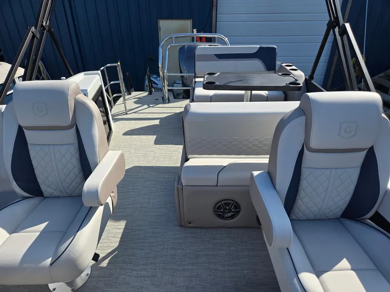 Slide: The Image of 2025 Godfrey SWEETWATER Entertainment 2486 DT boat interior with plush seating and modern design. - 12