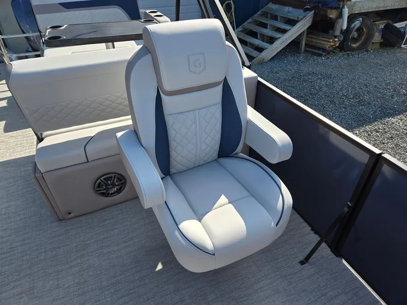 Slide: The Image of 2025 Godfrey SWEETWATER Entertainment 2486 DT boat seat, luxurious design, outdoor setting. - 13