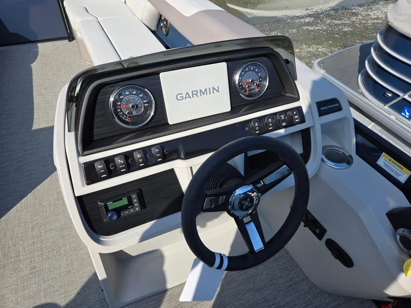 Slide: The Image of 2025 Godfrey SWEETWATER Entertainment 2486 DT boat dashboard with Garmin navigation system. - 15