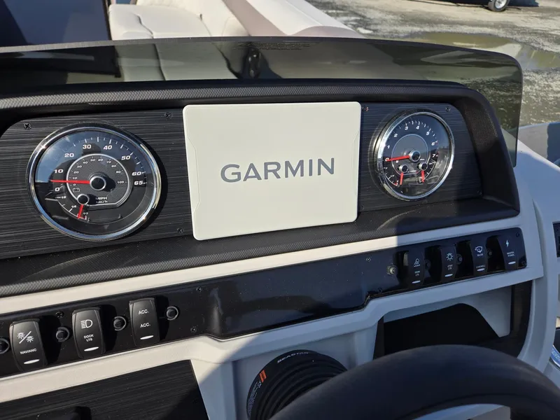 Slide: The Image of Dashboard of 2025 Godfrey SWEETWATER Entertainment 2486 DT with Garmin display and gauges. - 16