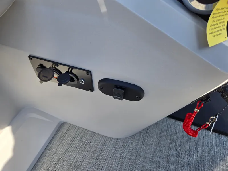 Slide: The Image of Control panel of 2025 Godfrey SWEETWATER Entertainment 2486 DT boat with safety features. - 19