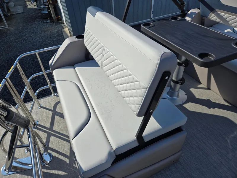 Slide: The Image of 2025 Godfrey SWEETWATER Entertainment 2486 DT boat seating with table, featuring modern design. - 25