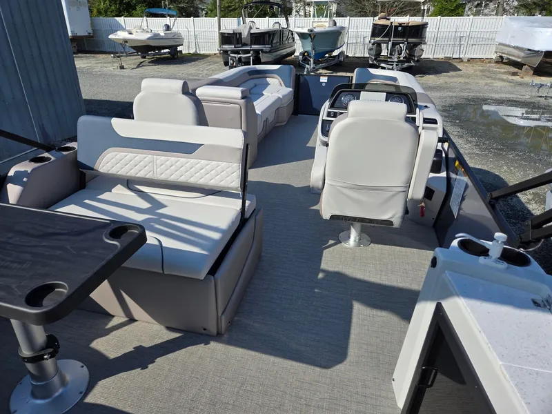 Slide: The Image of 2025 Godfrey SWEETWATER Entertainment 2486 DT pontoon boat interior with seating and table. - 31
